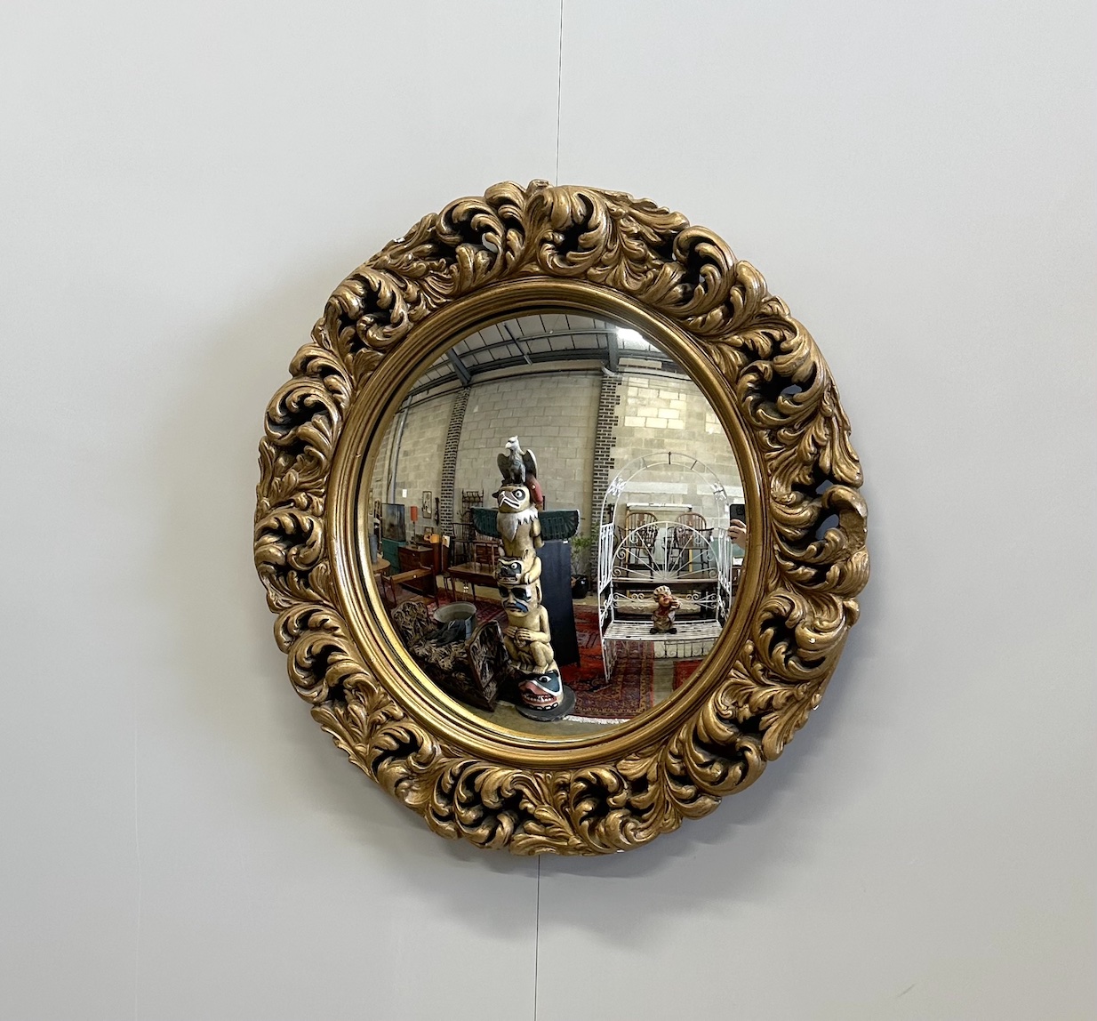 A circular gilt composition convex wall mirror, diameter 51cm